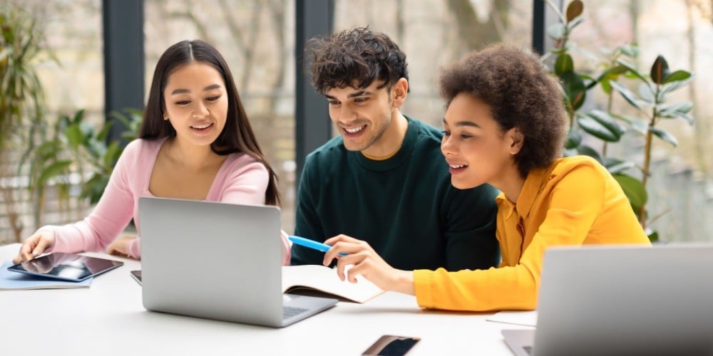 University students working on laptops.