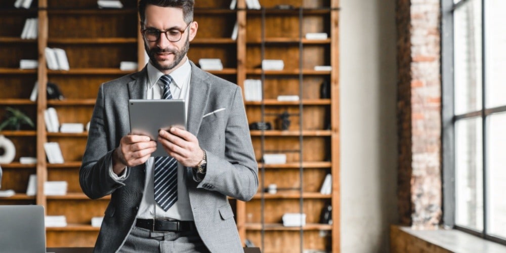 Lawyer viewing documents on a tablet.