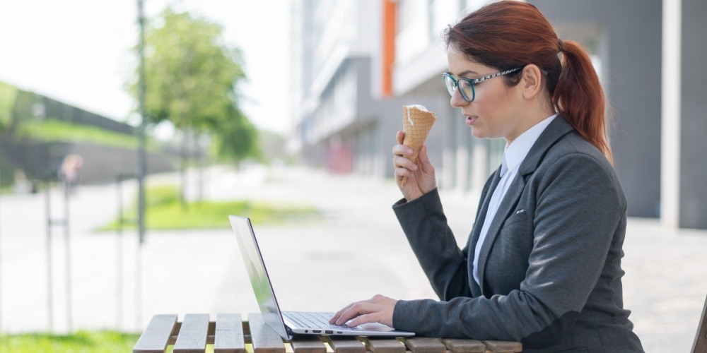 Woman working outside with an ice cream cone