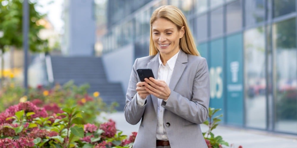 Woman checking in using Mobile ID 